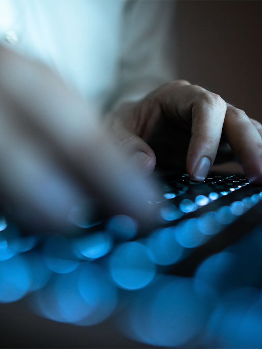 Trustarc Portrait 2 hands typing on keyboard