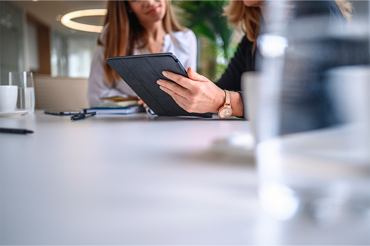 Responsibility Landscape 2 women talking over a tablet