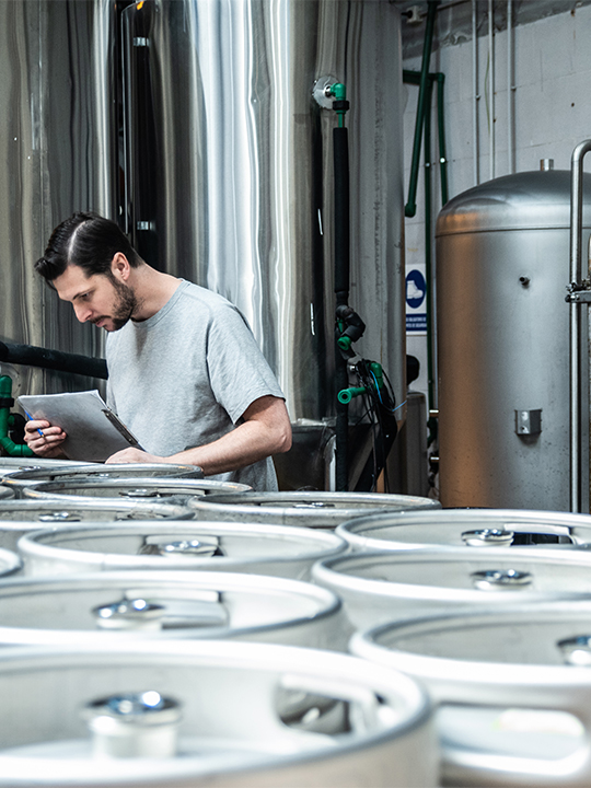 Keg Logistics Portrait 2 man inspecting kegs