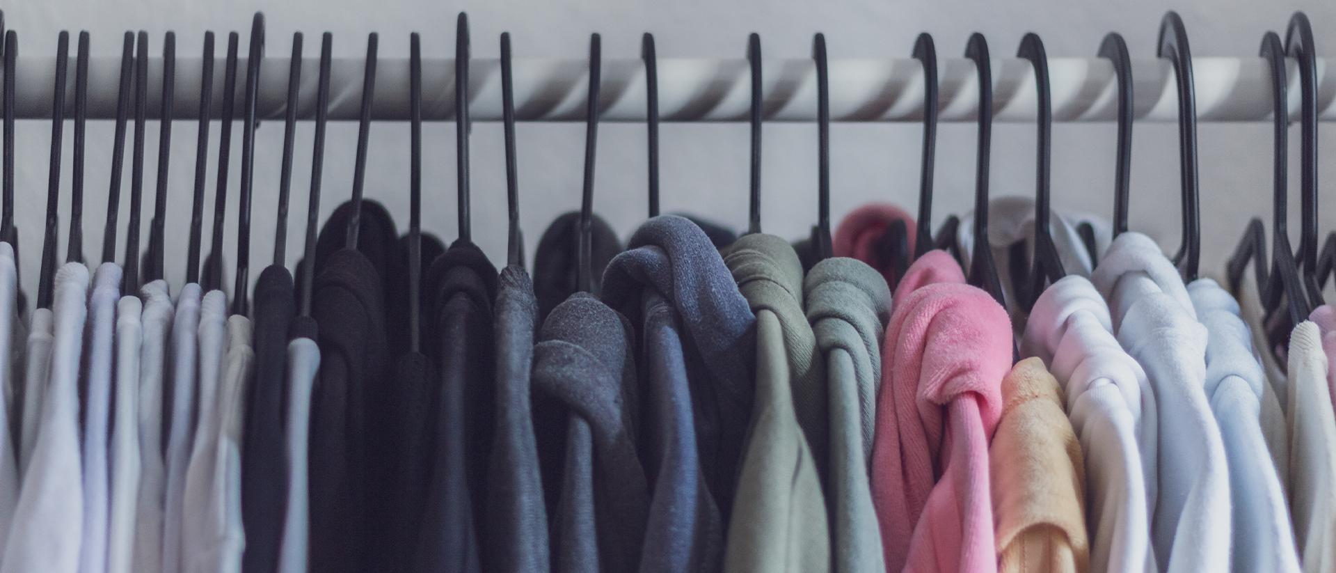 Printful Header 1 Clothes on a clothesrack