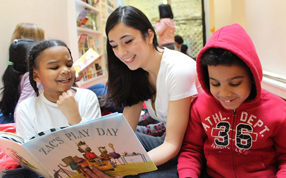 woman reading to children