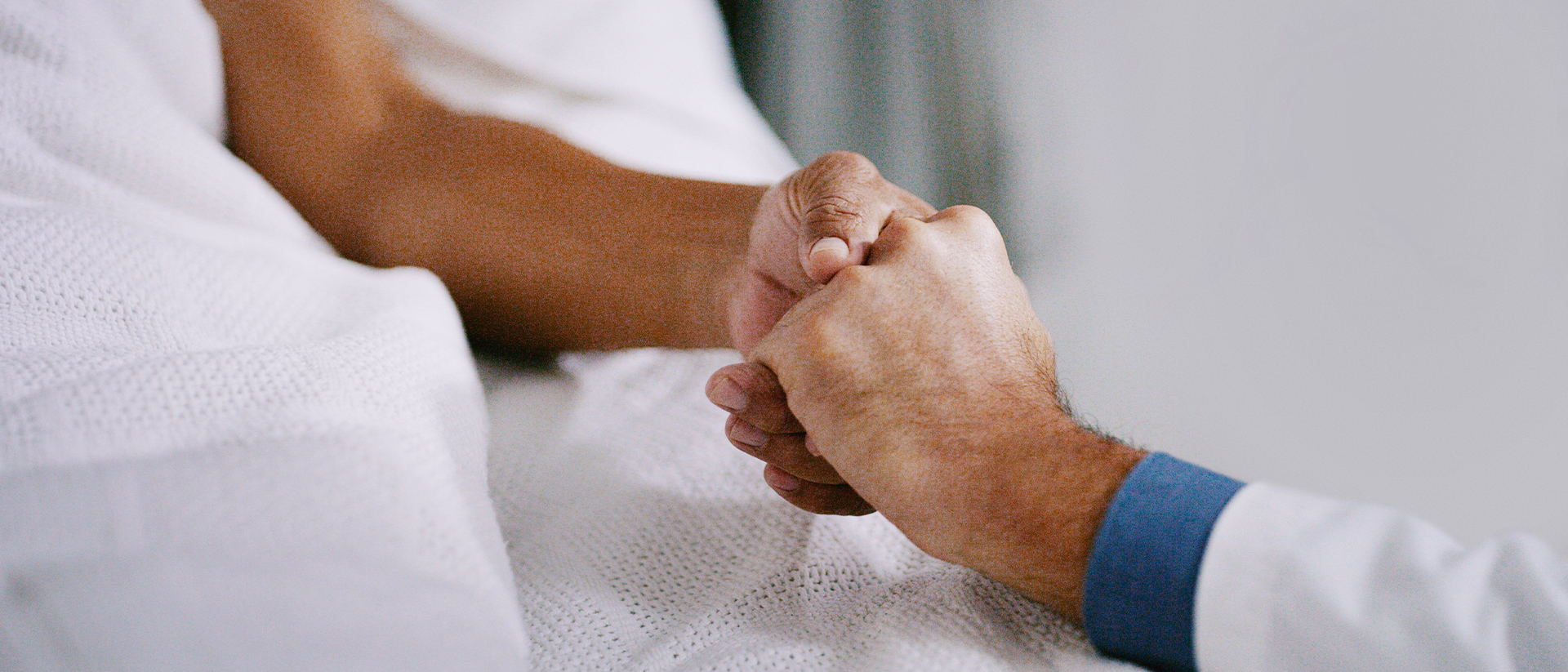 Key Health header image doctor holding patient's hand