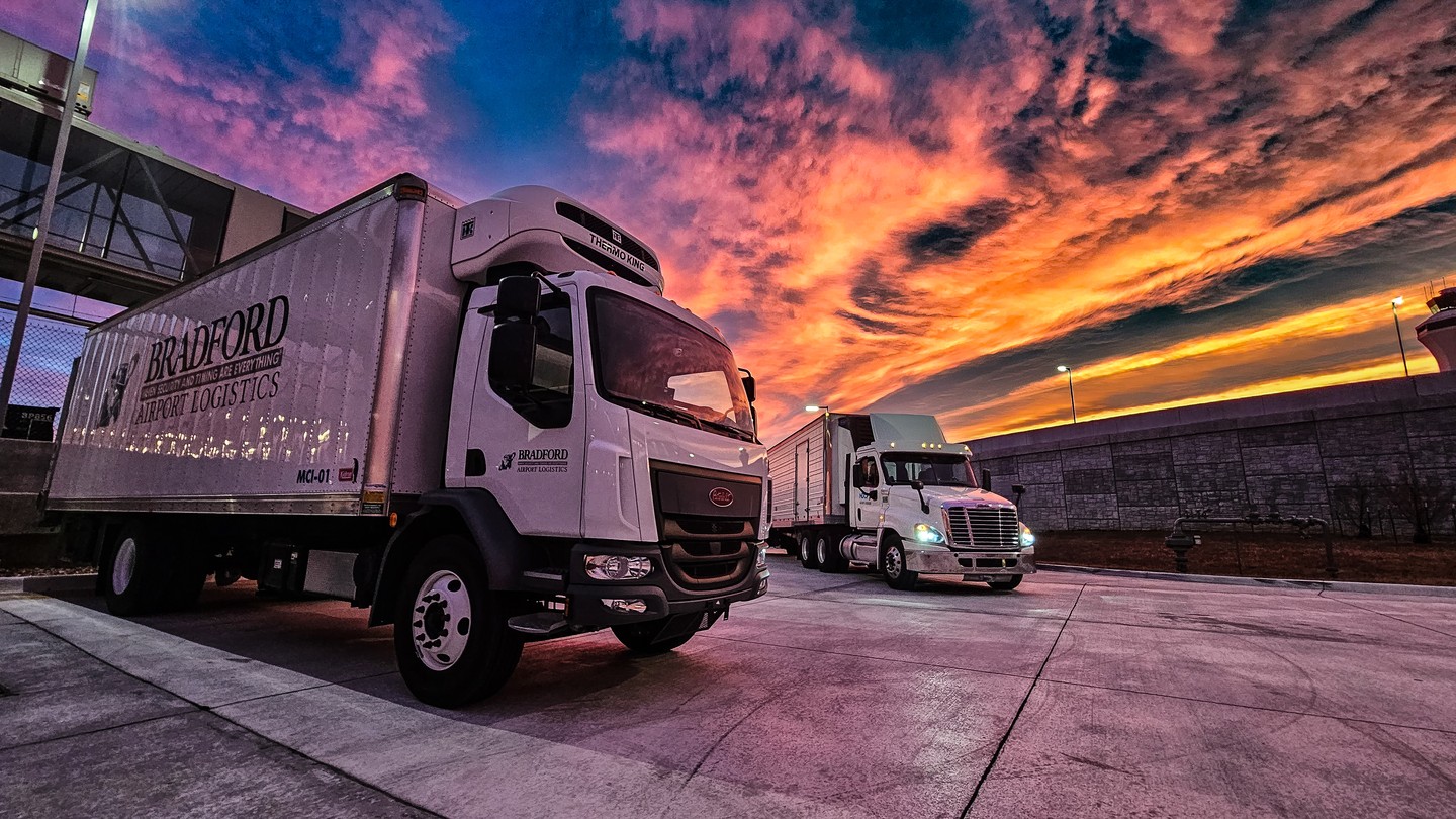 image of trucks at sunset