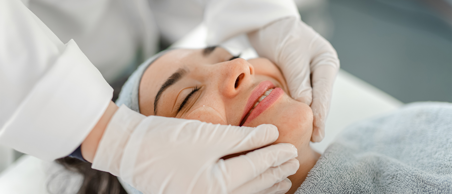 Integrated Dermatology header image woman getting facial