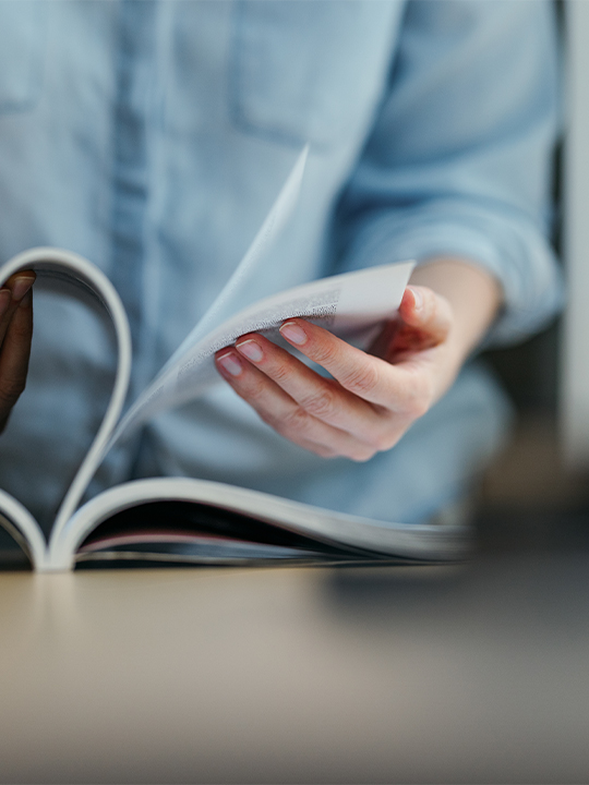 MEDIA Central Portrait 3 hands flipping through books