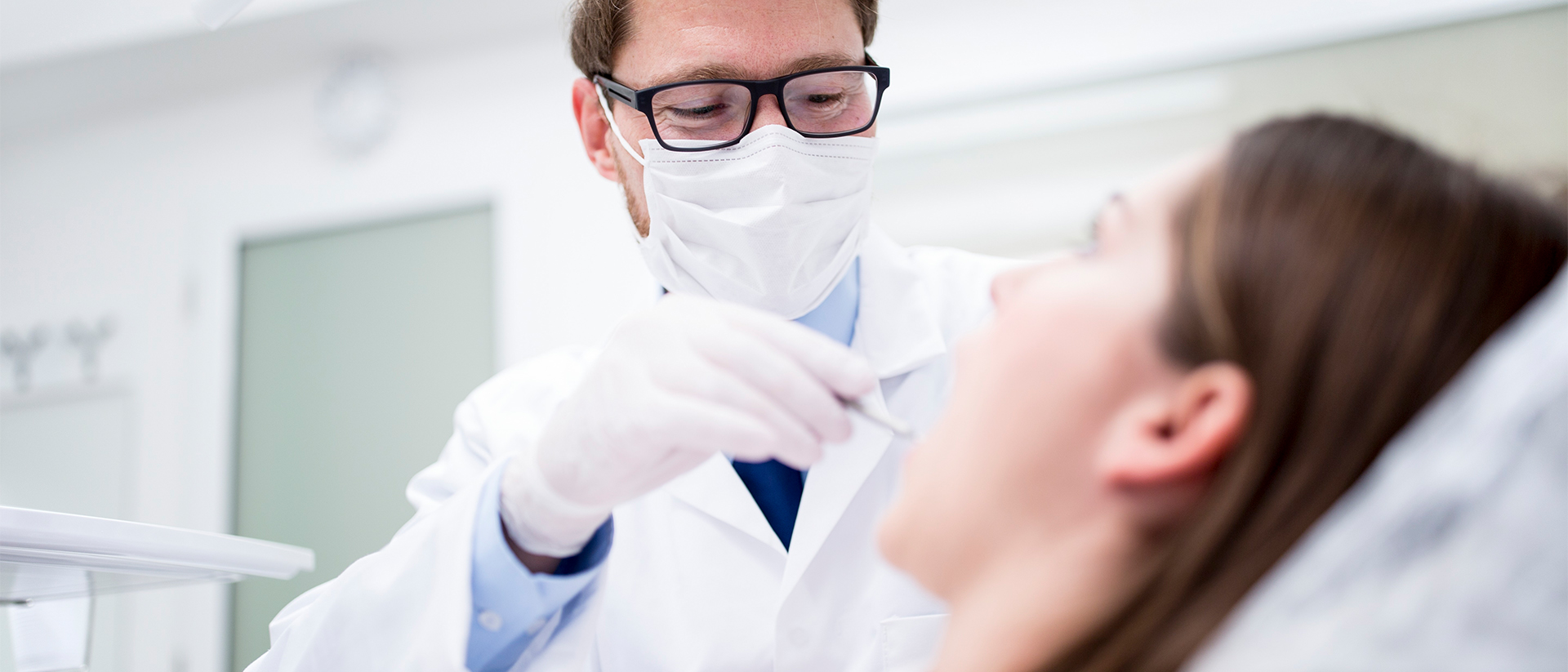 DentalXChange header image dentist working on patient