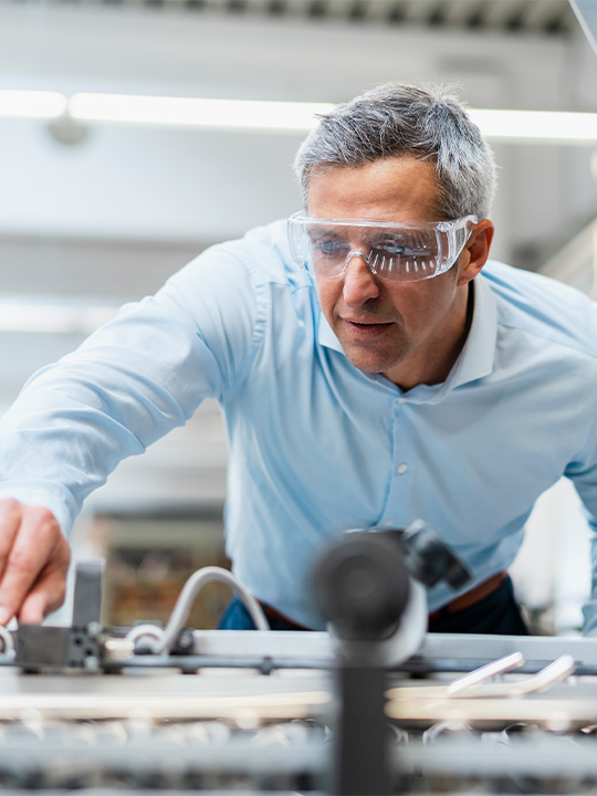 Lux Research Portrait 2 man working with safety goggles on