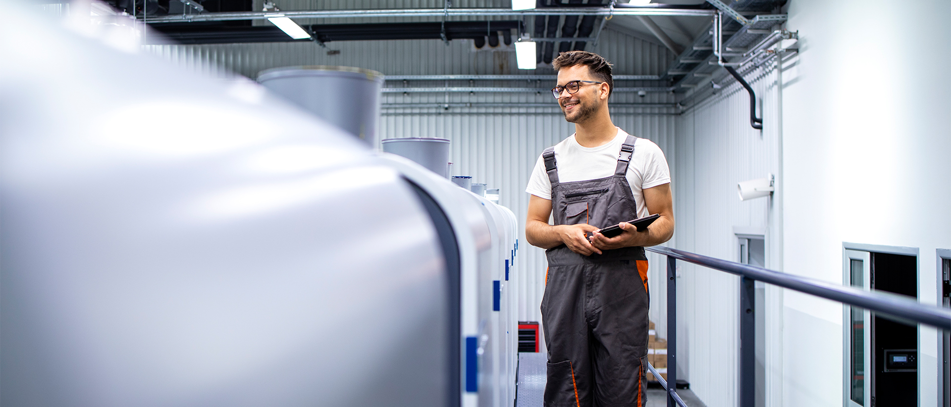 Printful Header 3 Man in overalls working