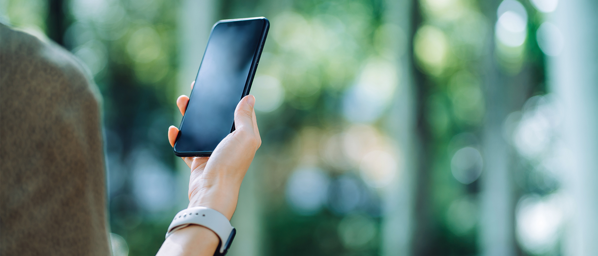 Cafeyn header image woman looking at phone